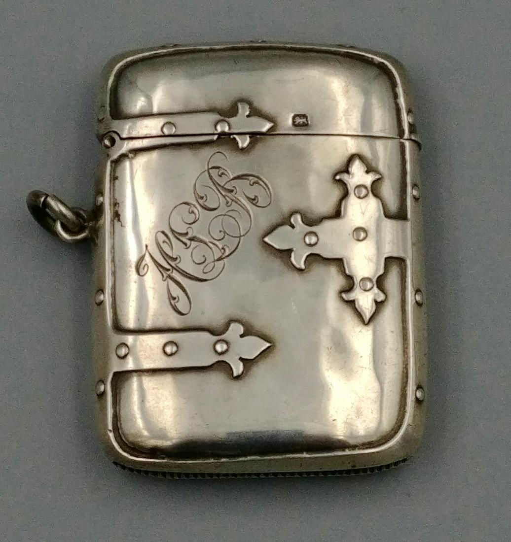 Sterling Silver Sheffield Trunk Match Safe: J.D. & S. (for James Dixon & Sons) impressed Crown, left facing Lion, lower case "n" for Sheffield, 1905. Also an impressed lion on the lift lid. Nice patina with sterling decorative hinges and straps