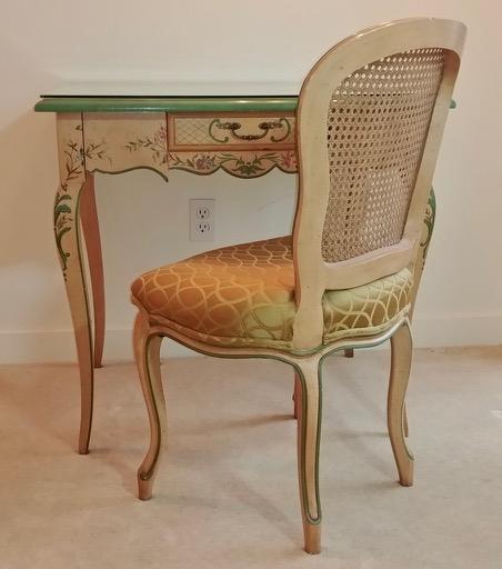 John Widdicomb French Ladies Desk & Chair: One drawer hand painted Ladies writing desk with chair. Green painted top. Glass top. Dovetailed drawer. Cane back, upholstered seat chair. 31" x 23" X 29" H; Chair is 33.5" H