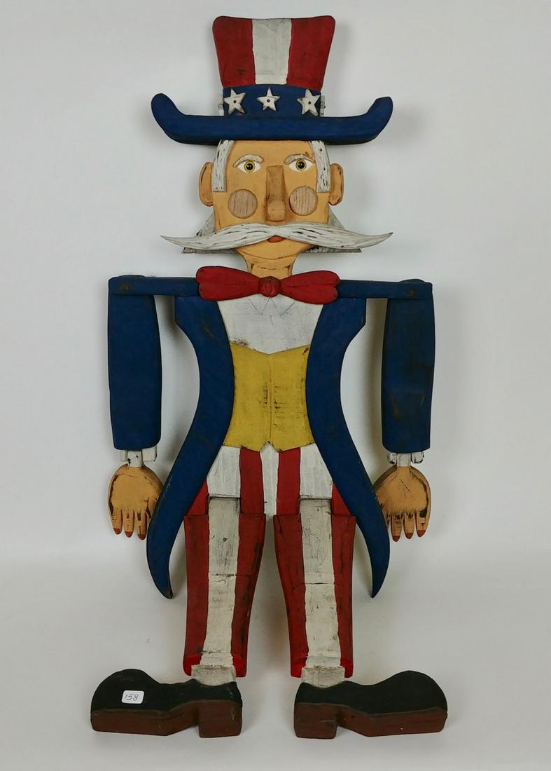 Bryan McNutt Uncle Sam Figure: Wooden jointed Uncle Sam figure in painted red, white and blue colors. Signed Bryan McNutt. 32" H