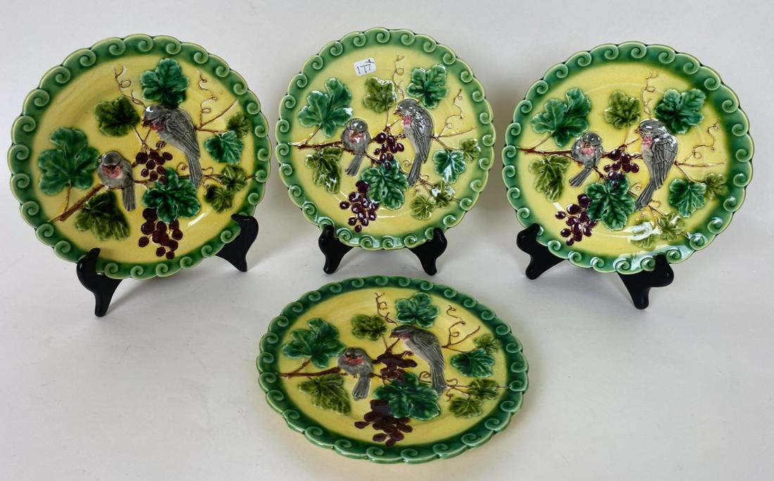 French Sarreguemines Majolica Bird Plates (4): Yellow plates with green trim, two grey birds with grape leaves and clusters. 8" D