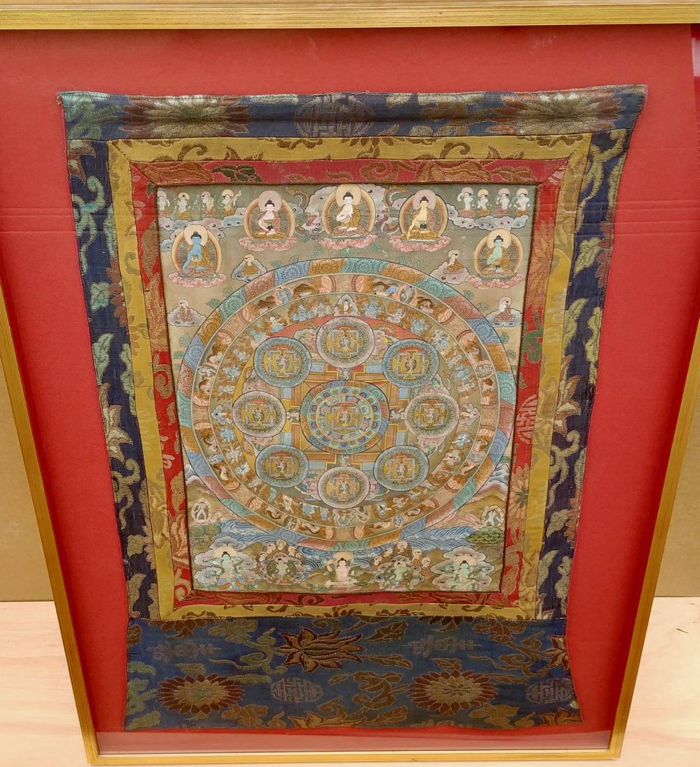Framed Buddhist Textile Under Glass: A prayerful, meditative Buddhist textile framed under glass. 34" H x 21" W (framed 39" x 29")