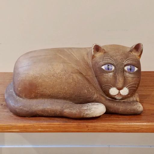 Folk Art Carved Cat Figure Signed Vincent Droeven: Reclining cat, white tipped tail near his face. 20" x 12"