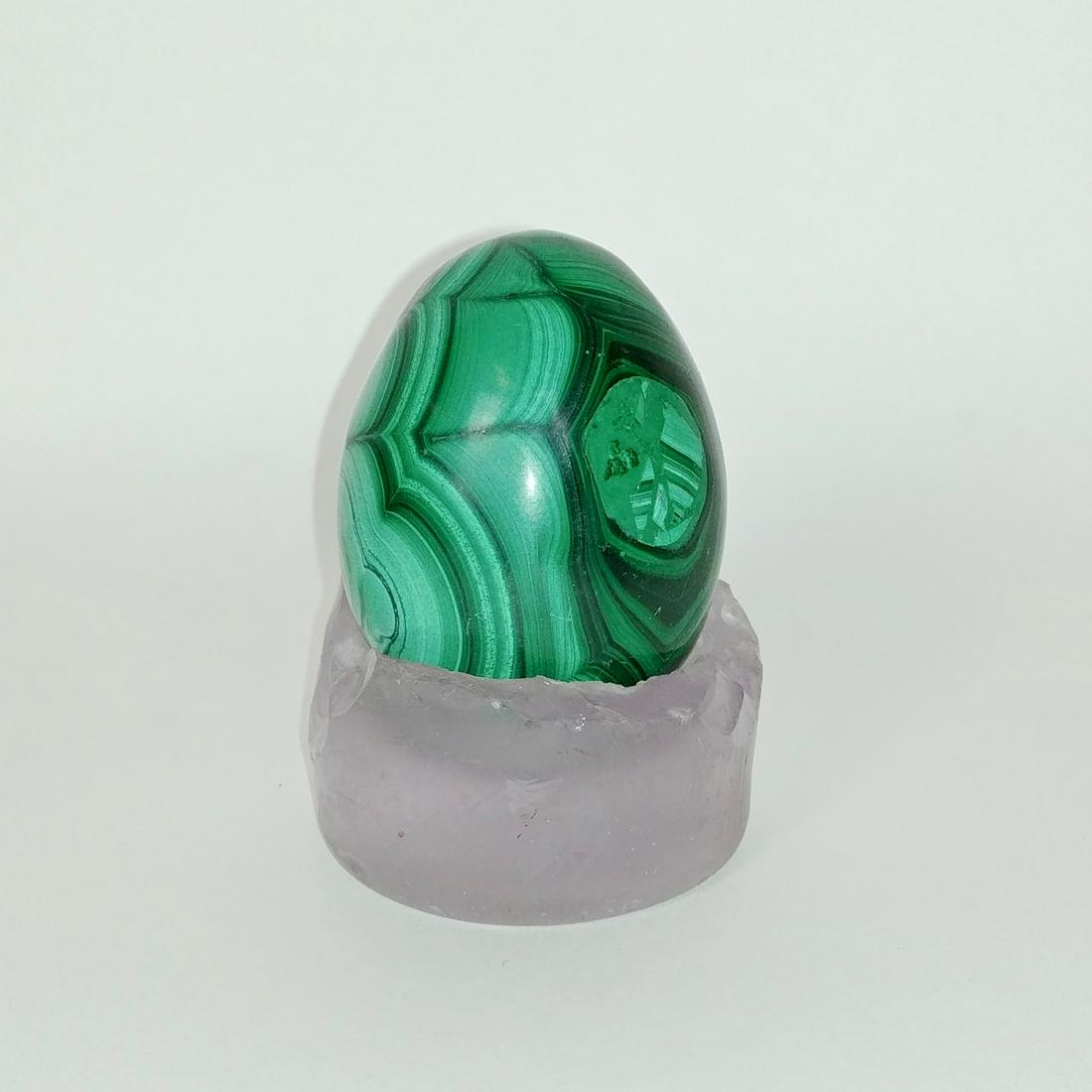 Green Marble Egg on Antique Bottle Base: Multiple shades of green marble in this beautiful egg. Sits atop an old bottle base, slightly amethyst in color. Egg measures 2.5" H