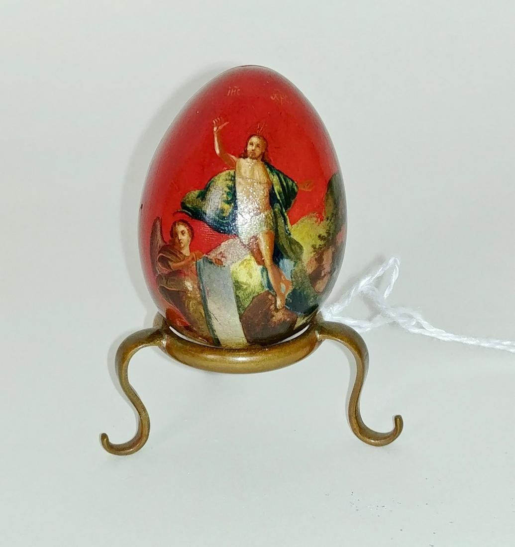 Russian Painted Religious Egg & Contents: Russian painted egg on copper tri-legged stand with image of Christ and an angel. Inside the egg we found an irridescent scarab (beetle) and a French silver religious Souvenir de Mont Martre. 1.75" H
