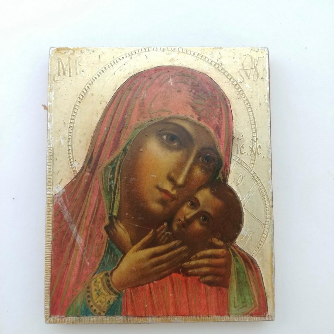 Small Russian Icon Madonna and Child: Gilt painted background. Scratch at left side as shown in photo. Marked at the reverse. 3" x 2.5"