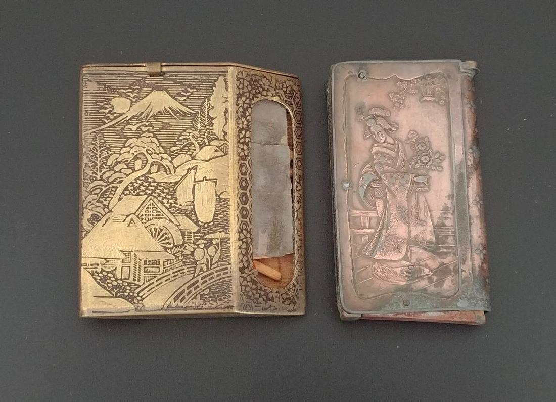 Japanese Copper and Celluliod Whiskey Adv (2): Japanese Copper Match Safe. In book form. Bird and floral on front side. Woman in kimono at the reverse. Wooden base. Vulcanite flip top lid. Striker at the side. Wood base is a bit loose. 6.3cm.; Tog