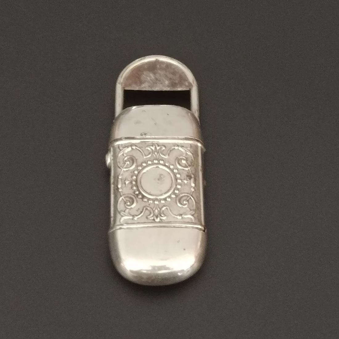 Nickel Plated Combo Safe & Cutter: Nickel plated combination match safe and cigar cutter. Embossed circular decorations on both sides of body. Pat. April 4, '82.