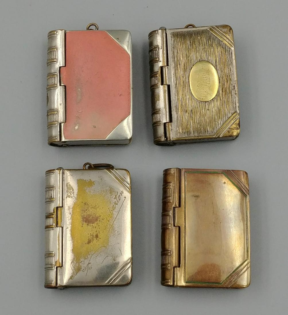 Plated Figural Book Match Safes/Stamp Holder (4): Lot of four silver plated and brass book form match safes. When the back cover is opened it reveals a section for postage stamps. Two have registration marks at the side or base. RD. 378671 (1907) and