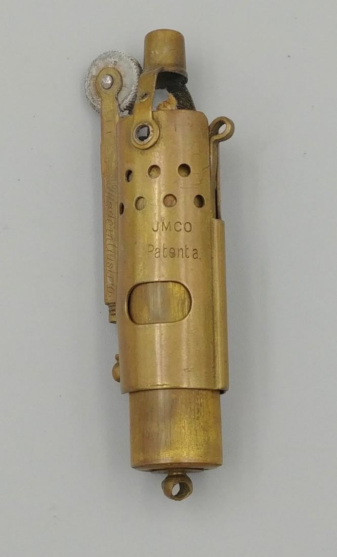 WWI Brass Trench Lighter JMCO: Rare WWI brass Trench Lighter. Made in Austria. JMCO Patent a. Patent No. 105107. Base is marked IMCO.