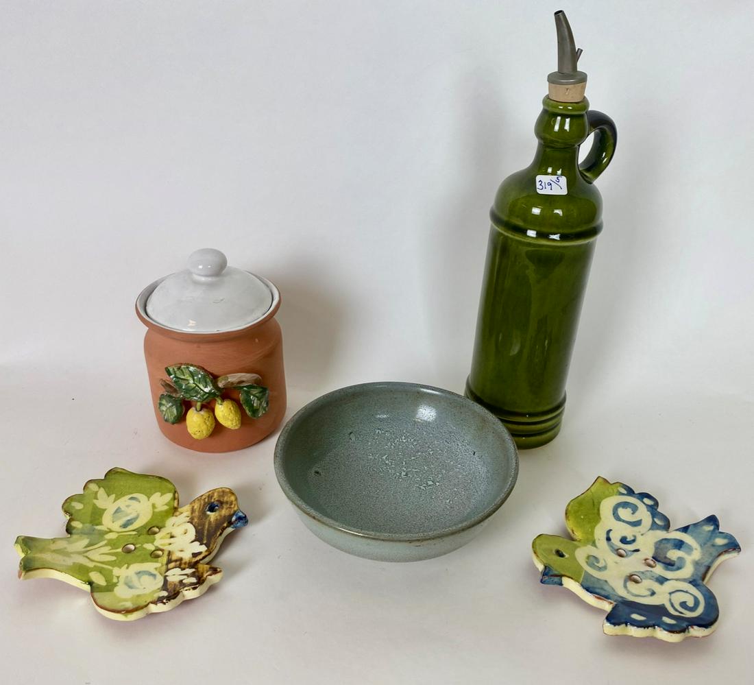 French Kitchen Stoneware Lot (5): Covered terracotta jar with applied lemons at the front marked Fait main au Vieux Vallauris; Oil jug with handle marked Le Poet Laval France; a blue bowl with impressed mark at the base; and two color