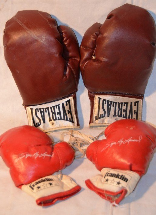 Boxing Gloves Everlast & Franklin Children's: Pair of maroon Everlast gloves, marked 2920 together with a pair of childrens Franklin gloves with Sugar Ray Leonard printed on the red right hand glove. No laces. 11"; 7-3/4" long