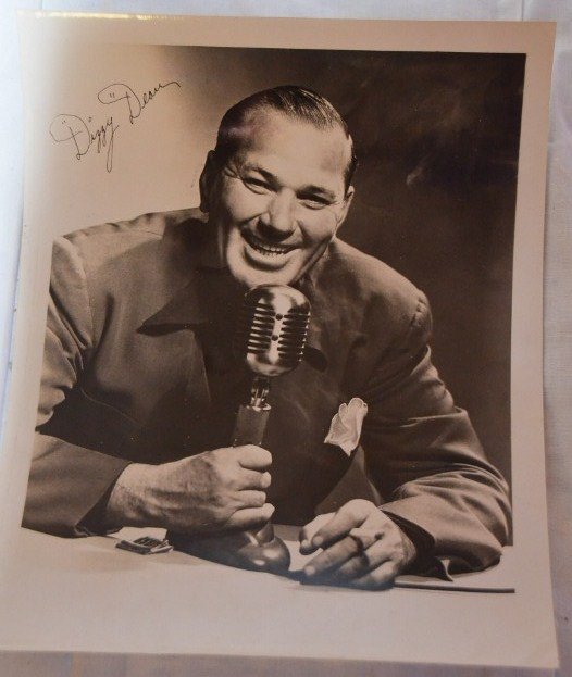 Dizzy Dean Promotional Photo: Dizzy Dean at a radio microphone with cigarette in hand. 8" x 10"