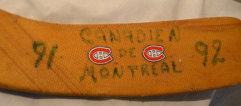 Signed Wood Hockey Stick - Canadians: 1991-1992 Canadians de Montreal. Includes signatures from Brian Skrudland, Mike McPhee, Mario Roberge, and many others. 64" long
