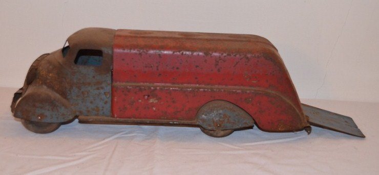Vintage Metal Truck: Transport truck. Maybe 1940's. Blue cab with red box drop down rear door. Fender skirts on the tires. No identifying marks. 17-1/2" long