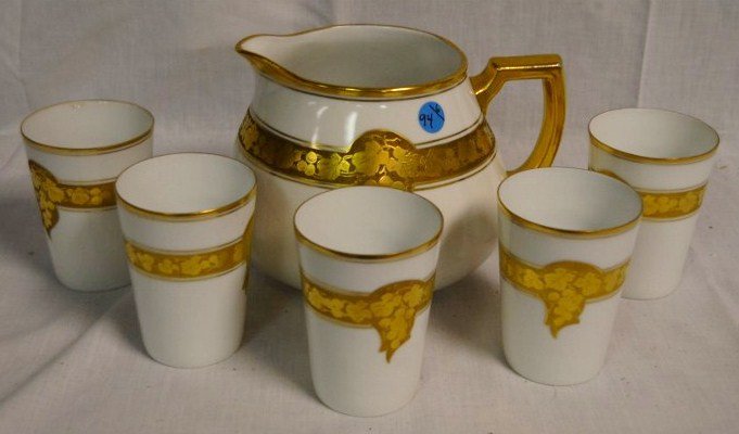Bavarian China Beverage Set: Pitcher and 5 glasses. Gilt grape leaf decoration. 6" high; glasses are 4" high