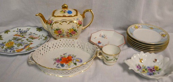 Lot of Porcelain Pieces: Six Noritake dessert plates; Sadler English teapot; Limoges pansy decorated dish; MMA Meissen dish; Nymphenburg double handled lattice edged plate; French hand painted Delft plate with birds; a demita