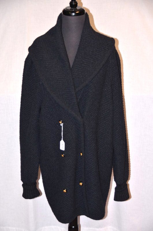 Chanel Boutique Shawl Collar Sweater: Black wool sweater with six Chanel logo buttons at front. 34" from shoulder to bottom of sweater. NOTE: All clothing & accessories are in "as found in the closet" condition