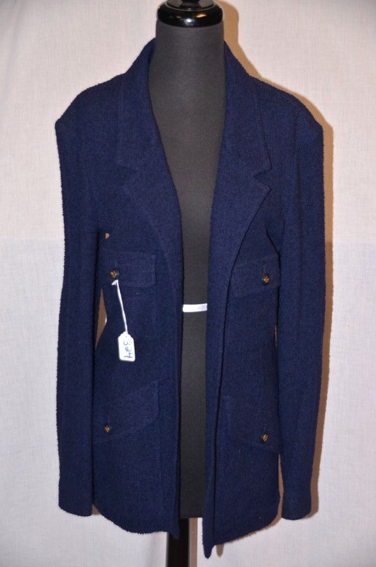 Chanel Boutique Navy Nubby Blazer: No lining. Style 2584. 96% wool, 4% nylon. Three buttons on each sleeve. Unstructured. Fabric sample label attached. 31" from shoulder to bottom hem. NOTE: All clothing & accessories are in "as found