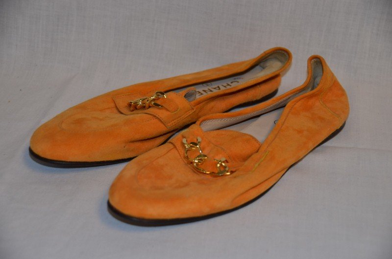 Chanel Suede Loafer Style Shoes: Pumpkin color with chain decoration. Leather soles. Size 38. Style 82330000. NOTE: All clothing & accessories are in "as found in the closet" condition.