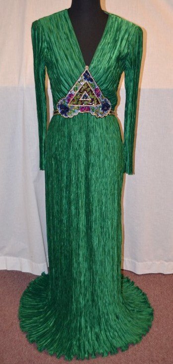 Mary McFadden Couture Gown: Size 6. Saks Fifth Avenue. Full length long sleeve green gown with beads and sequins. NOTE: All clothing & accessories are in "as found in the closet" condition.