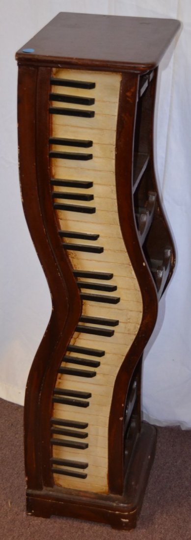 Piano Keyboard Wine Bottle Tower: Holds 13 bottles of wine. 38" high x 12" wide