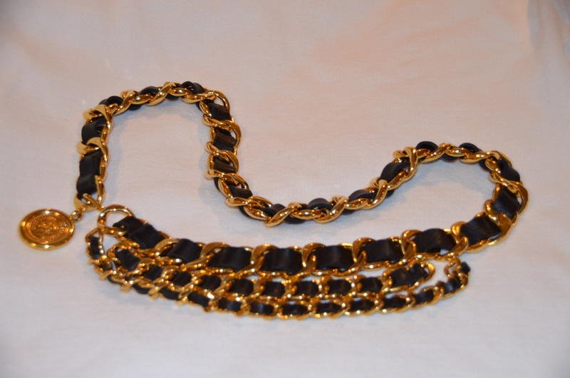 Chanel Gold Tone and Leather Chain Link Belt: Vintage Chanel gold tone and leather chain link belt. Terminating medallion reads, Coco Chanel, Paris, France on one side and Chanel 31 Rue Cambon Paris on the other. 36" long unhooked including the m