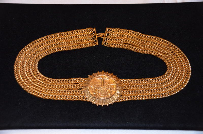 Chanel Vintage Chain Medallion Choker: Chanel vintage four chain choker with central medallion. Signed Chanel, Made in France. Of considerable weight. 10" long when closed; including the 2" diameter medallion.