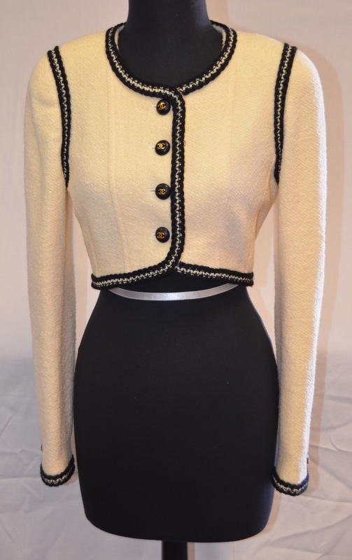 Vintage Chanel Ivory Wool Cropped Jacket: With original fabric stock label that reads: Style: 1446; Size: 38; Color: 10107; 100% Wool with Silk lining. Chanel Boutique, nubby ivory wool with black and ivory braided trim. Short cropped jacket