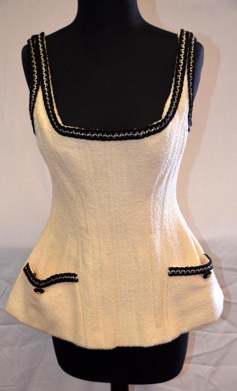 Vintage Chanel Ivory Wool Bustier: En Suite to Lot 145. With original fabric stock label that reads: Style: 1476; Size: 38; Color: 10107; Fabric: VO 2245; 100% Wool with Silk lining. Chanel Boutique, nubby ivory wool with black and ivo