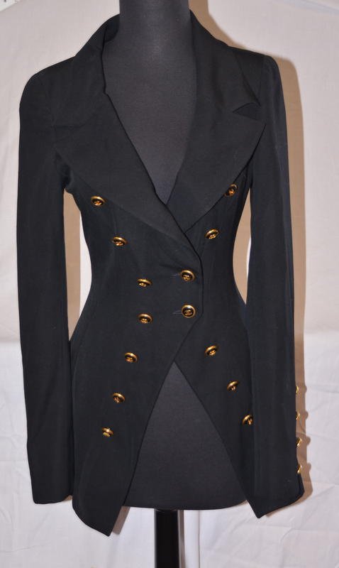 Vintage Chanel Black Wool Blazer: Chanel Boutique interior label. No original sample label. Seven Chanel logo buttons on each side of the closure, two of these buttons are used for the closure. (They have reinforced backs on them as s