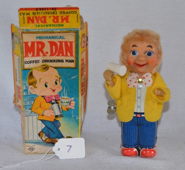 Mechanical Mr. Dan Coffee Drinking Man Toy: Tin wind up toy in original box. Missing his coffee cup. In working order. Marked Trademark, TN, Made in Japan. 7" high