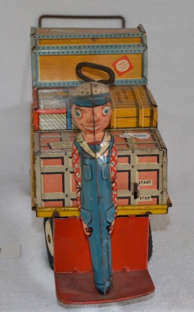 Rare Mechanical Tin Railroad Toy: Conductor stands at front of train loaded with luggage. Wheels turn. Nice graphics. Unique Art, Mfg. Co. USA 13-1/2" long