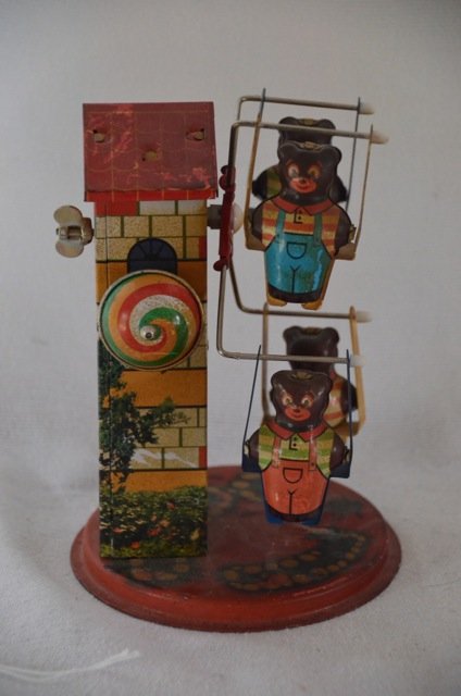 Rare Tin Wind Up Ferris Wheel Toy with Bears: Unmarked, probably Japanese, tin mechanical wind up ferris wheel toy with four bears at a tower. Has a bell. Some scratches to the back of tower as shown in photo. 7" high