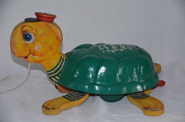 Fisher Price Timmy Turtle Musical Toy: Wooden pull toy. Some paper loss on graphics as show in photos. 12" long