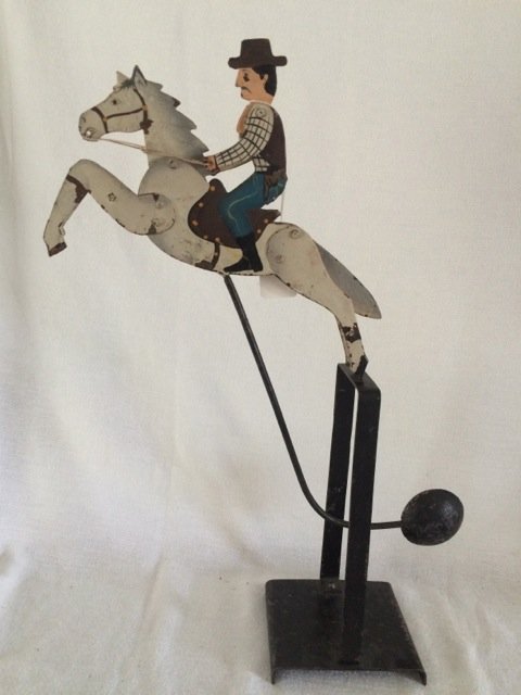 Western Horse and Rider Balance Toy: Vintage metal western horse & rider balancing toy on stand. Original paint. String movements. 18-1/2" high on stand; horse is 11" long