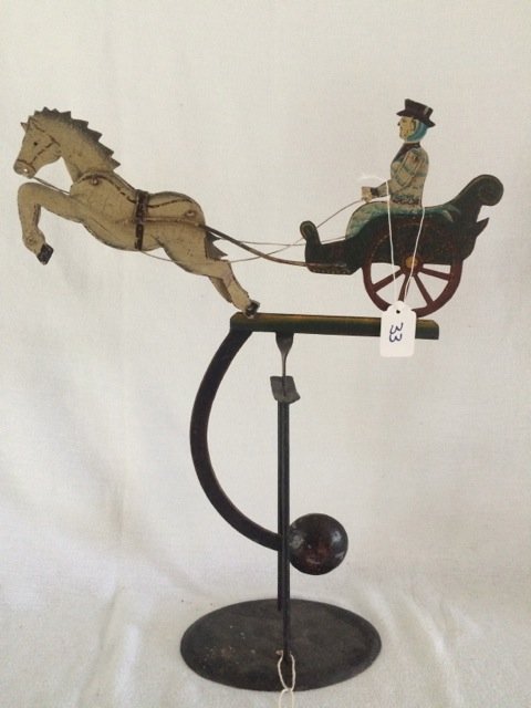 Horse and Carriage Balance Toy: Horse and carriage balancing toy on stand. Made in Indonesia. 17-1/2" high; horse & carriage are 14-1/2" long
