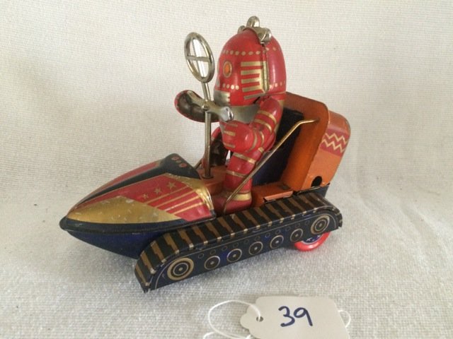 Vintage Tin Robot in Spaceship Tank: Red mechanical robot in space rover tank toy. Nice graphics. Probably made in Japan. 6" long
