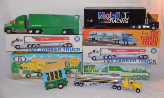 Lot of 8 Gas Station Tractor Trailer Trucks: Sunoco Safari Shuttle, Mobil, Exxon, BP, Shell. Plastic and metal. Approx. 15"