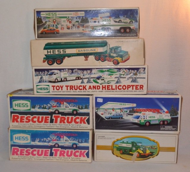 Lot of 8 Hess Trucks: 1994 (2); reproduction of the first Hess truck; 1996; 1997; 1991; 2006; and a vintage 1977.