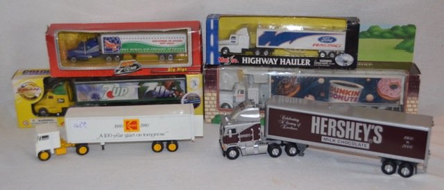 Lot of Advertising Tractor Trailers (6): Small trailers for Ford Racing - Hot Zone; 7-Up; Dunkin Donuts; Kodak; and Hersheys. Varying sizes