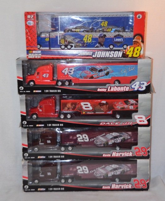 5 Race Car Themed Tractor Trailers with Cars: Winner's Circle brand, two Kevin Harvick #29 1/64th scale; a Dale Jr. #8 1/64th scale; Jimie Johnson #48 1/64th scale including 2 stock cars; Bobby Labonte #43 1/64th scale. 15" long the box.