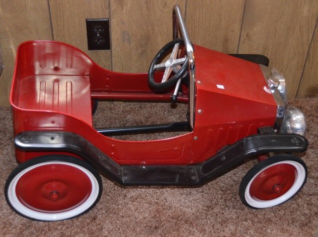 Child's Pedal Car: Red pedal vehicle, 1938 model reproduction. 31" long