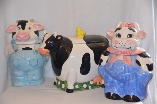 Three Cow Cookie Jars: A boy and a girl; together with a _____________. 7-1/2" x 10"; 12" x 9"