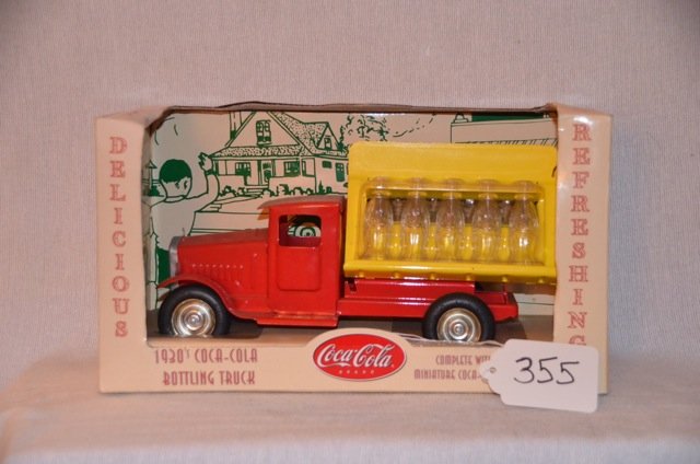 Coca-Cola Bottling Truck Replica 1930's: New in packaging. Steel axels, rubber tires, stamped steel, real glass bottles. Gearbox Toys and Collectibles, Cedar Rapids, Iowa. 11" long