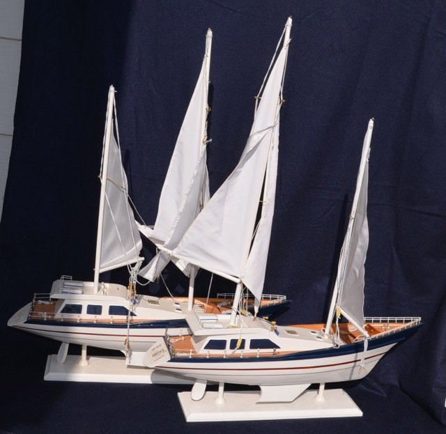 Two Wooden Model Sailing Yachts: White boats with blue trim and white sails. 22" long