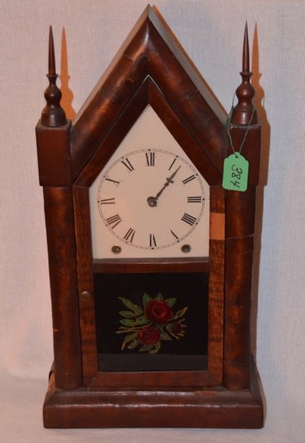 Ansonia Gothic 8 Day, 30 Hour Clock: Vintage Ansonia 8 Day, 30 Hour Gothic Clock. Reverse painting on glass of a rose bouquet. Slight damage to the right front on the wood. Made by the Ansonia Brass and Copper Company in Ansonia, Conn. 2