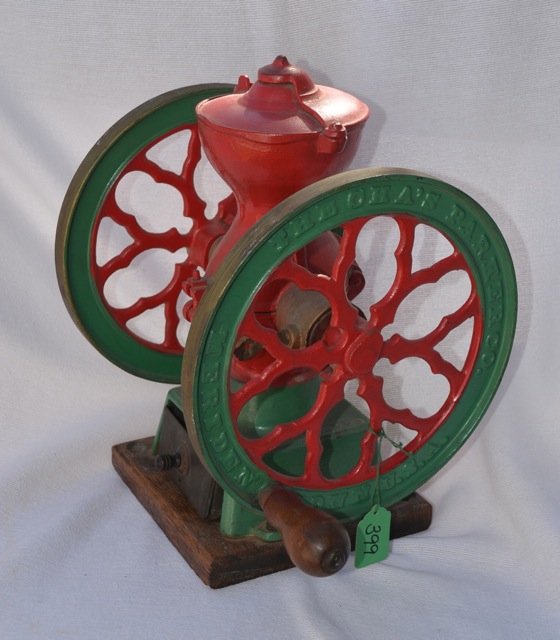 Cast Iron Painted Coffee Grinder: Cha's Parker Company, Meriden, Conn., USA. Green and red painted. On wood base. Drawer does not look to be original to the grinder. Appears to have been repainted. Approx. 12" high