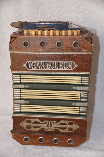 1920's Pearlqueen Concertina Accordian: Wood and paper concertina. Mother of pearl terminations on the push button keys. Number 4303. Vitak-Elsnic. 13" long x 8-1/2" w x 9-3/4 when closed.