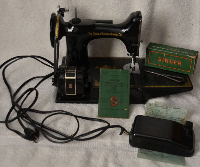 Singer Portable Sewing Machine 221-1: With extra parts and attachments. Original box and instruction manual. Box diminsions are 14-1/2" x 8-1/2" x 11" high