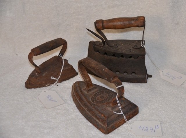 Three Cast Iron Sad Irons: #4, #8 and fill it yourself pounds. NE But Co.